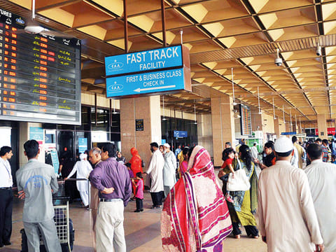 Passengers at Jinnah International Airport, in Karachi. Pakistan is set to issue e-passports by June this year.