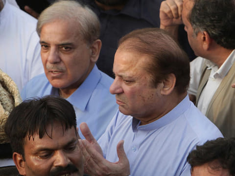 File picture shows ex-PM Nawaz Sharif, and his brother, PM Shehbaz Sharif in Lahore on September 14, 2018 at the funeral of Nawaz's wife Kulsoom Nawaz. 