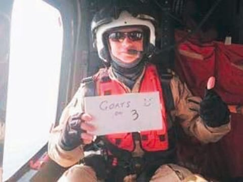 Paramedic Mark Roxburgh holds up a placard saying ‘Goats on 3’, which was his former rugby club RAK Goat’s war cry.