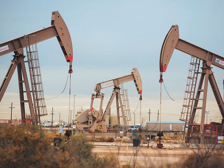 Pump jacks extract crude oil from oil wells