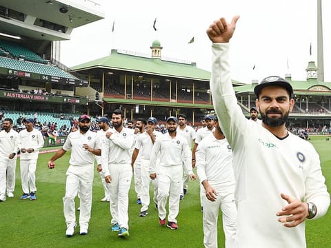 India’s captain Virat Kohli (R) gestures as the India team celebrates their series win against Australia at the Sydney Cricket Ground in Sydney on January 7, 2019. 