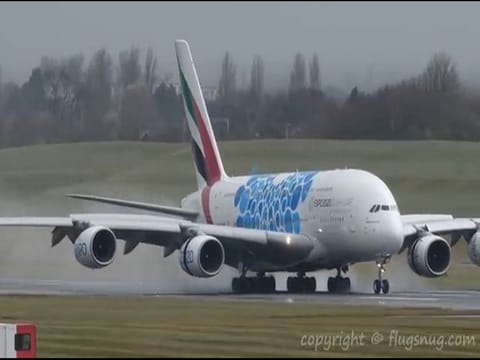 Pilots finally manage to land world's biggest plane after being buffeted by strong winds.