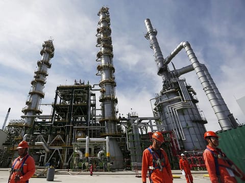 File photo: Employees walk at Mexico's national oil company Pemex's refinery in Salamanca, in Guanajuato state, Mexico.