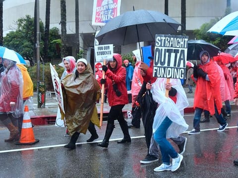 Thousands of teachers march in the rain through Los Angeles, California on January 14, 2019.