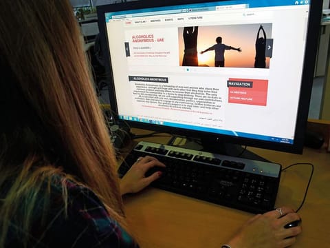A UAE resident looking at the Alcoholics Anonymous website. 