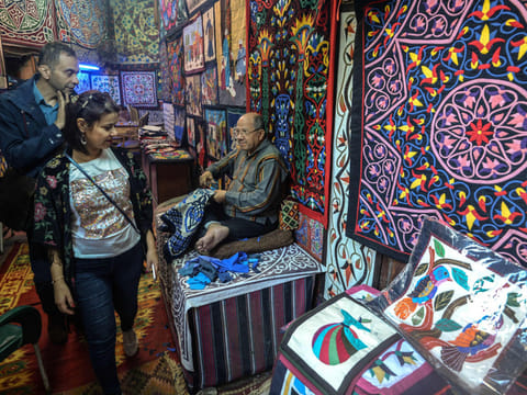 Tourists Khayamiya Street in the old city of the Egyptian capital Cairo. Egypt is the only country in the Middle East and North Africa (MENA) that avoided a negative GDP growth in 2020 despite the impact of COVID-19.