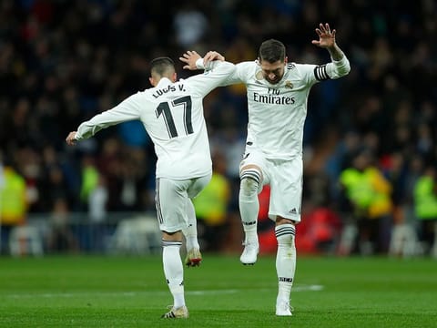 Real Madrid's Lucas Vazquez, left, celebrates after scoring with his teammate Sergio Ramos.
