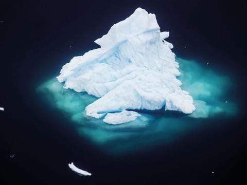 An iceberg floats in a fjord near the town of Tasiilaq, Greenland, on June 24, 2018