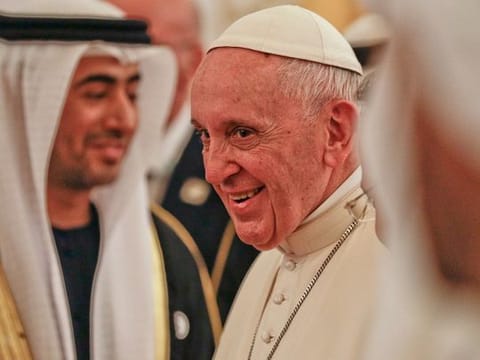 Pope Francis smiles upon his arrival at the Abu Dhabi airport, United Arab Emirates