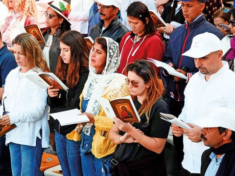 Worshippers from all walks of life take part in the service during the papal mass.