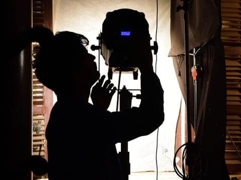 A lightman adjusts the spotlight during a shooting of Sony SAB TV's new serial ‘Beechwale – Bapu Dekh Raha Hai’ at the Filmcity in Goregaon.