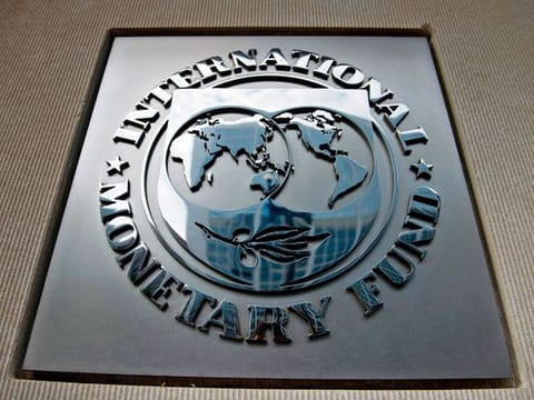 A logo is seen outside the headquarters of the International Monetary Fund (IMF) in Washington, DC