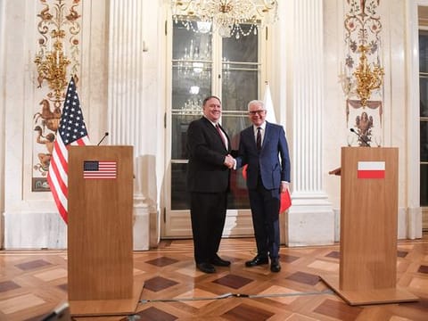 Polish Foreign Minister Jacek Czaputowicz (R) and US Secretary of State Mike Pompeo shake hands during a joint press conference