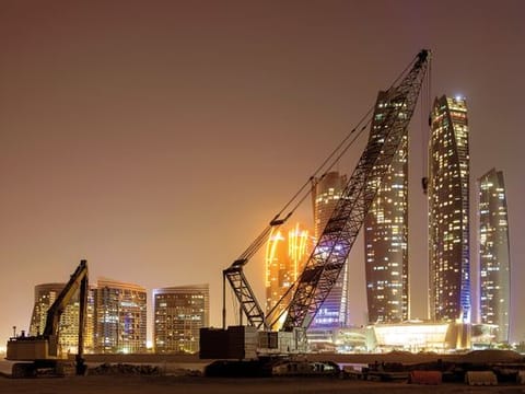 A construction site in Abu Dhabi. The new regulation enables the Central Bank to allow more property financing as needed. Analysts say this is crucial for the completion of projects that had been hounded by funding challenges