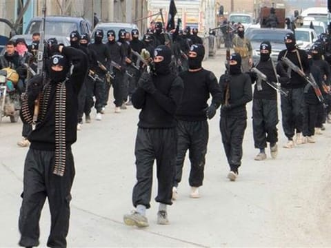 This file picture shows Daesh terrorists parading along a street in an undisclosed location in Syria.