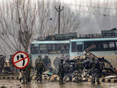Security personnel carry out the rescue and relief works at the site of suicide bomb attack at Lathepora Awantipora in Pulwama district of south Kashmir, Thursday, February 14, 2019.