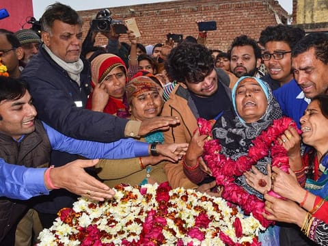  Family members of slain CRPF Jawan Kaushal Kumar Rawat pay their last respects before his funeral procession, in Agra, Saturday, Feb. 16, 2019. Rawat lost his life in Pulwama terror attack. 