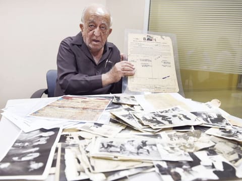 M.S. Faruk shows his collection of rare photographs and documents. Among his possessions is an 1879 stamped envelope addressed to the Ruler of Sharjah. 