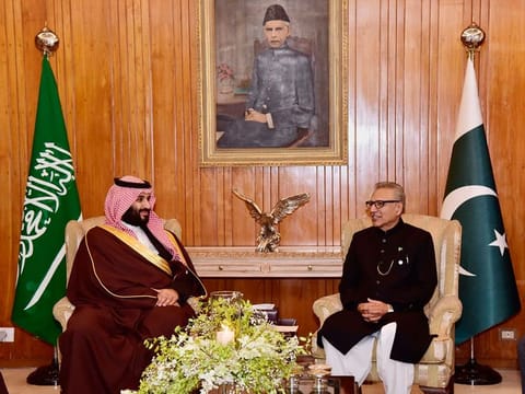 In this photo released by the Press Information Department, Pakistani President Arif Alvi, right, meets with visiting Saudi Arabia's Crown Prince Mohammad bin Salman at presidential palace in Islamabad, Pakistan, Monday, Feb. 18, 2019. 