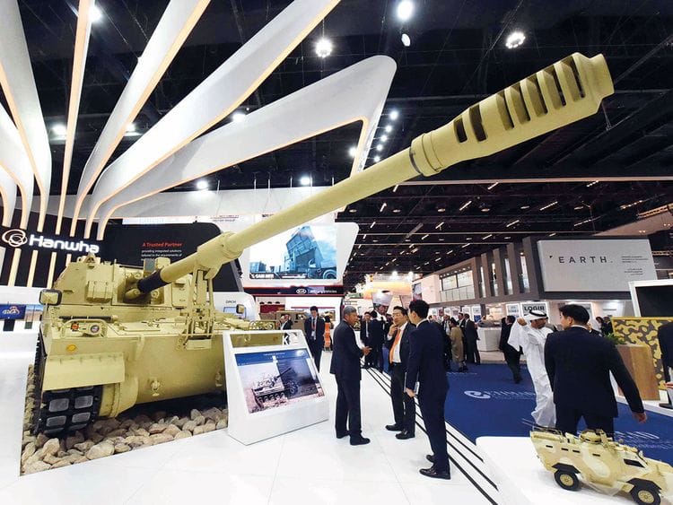 Visitors look at South Korean Hanwha Land Systems