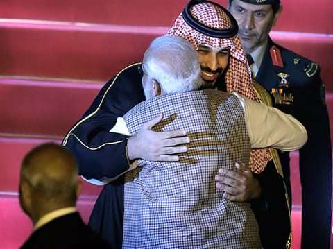 Saudi Crown Prince Mohammad Bin Salman (L) and India's Prime Minister Narendra Modi (R) embrace during a cermonial reception at the presidential palace in New Delhi on February 20, 2019. 