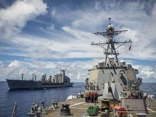 The operation guide ships through the Strait of Hormuz will be halted because progress has been made toward reaching a deal with Iran, the US president says.