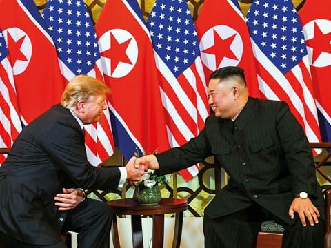 US President Donald Trump (L) shakes hands with North Korea's leader Kim Jong Un following a meeting at the Sofitel Legend Metropole hotel in Hanoi on February 27, 2019.