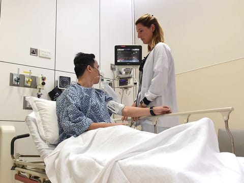 A doctor checking on a patient at the Emergency Department at Cleveland Clinic in Abu Dhabi.