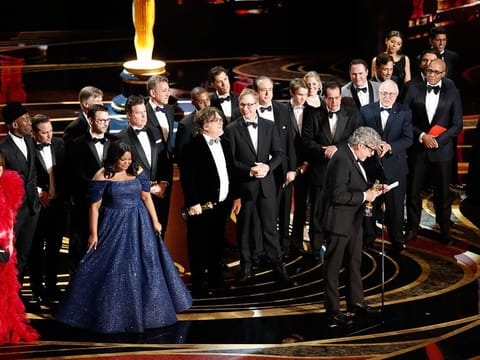 Peter Farrelly with the cast and crew of "Green Book" after being awarded best picture during the 91st annual Academy Awards at the Dolby Theater in Los Angeles, Feb. 24, 2019.