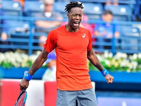 Gael Monfils roars with excitement after defeating Ricardas Berankis in the quarter-final of the Dubai Duty Free Tennis Championships.