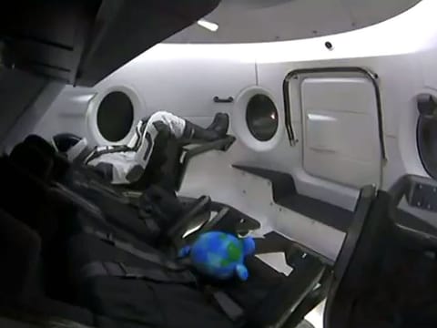 This video grab taken from the Space X webcast transmission on March 2, 2019, shows a dummy named Ripley onboard a SpaceX Falcon 9 rocket with the company's Crew Dragon spacecraft onboard lifting off during the Demo-1 mission, at the Kennedy Space Center in Florida on March 2, 2019. 