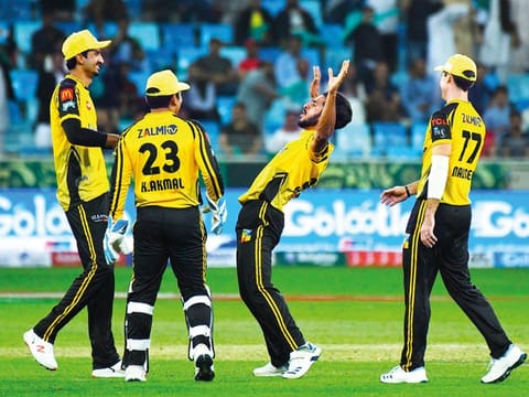 Peshawar Zalmi players celebrate after a win over Lahore Qalandars during 2019 edition of PSL in the UAE.