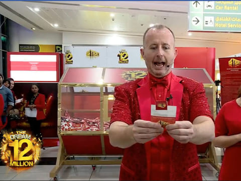 The host of the Big Ticket draw in Abu Dhabi announces one of the winners.