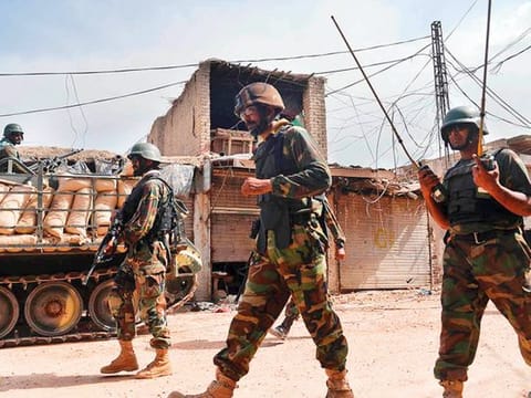 Pakistani soldiers patrol an empty bazaar in Miranshah in North Waziristan. 