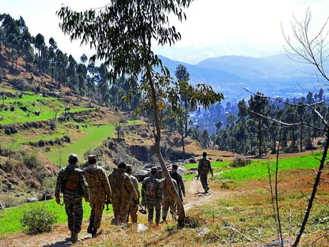Pakistani soldiers patrol in the area where Indian planes were reportedly shot down by Pakistani forces, after India launched airstrikes on February 26th, in Jaba, near Balakot.