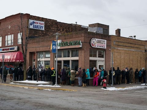 Customers line up at the New Palace Bakery, on Fat Tuesday in Hamtramck, Michigan.