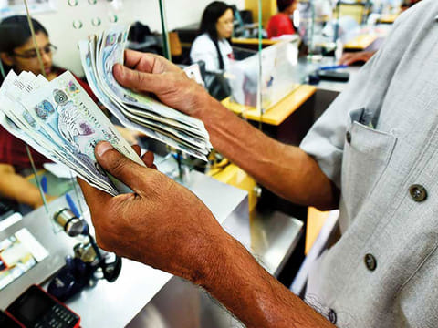 Filipino women sending money back home to support their families at UAE exchange branch in Satwa.
 A Filipino rights group in the UAE has launched an online petition to junk a controversial remittance draft law that would compel them to send money to their legal dependents or risk non-renewal of their passports.
