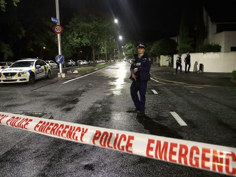 A police officer patrols at a cordon near a mosque in central Christchurch, New Zealand.