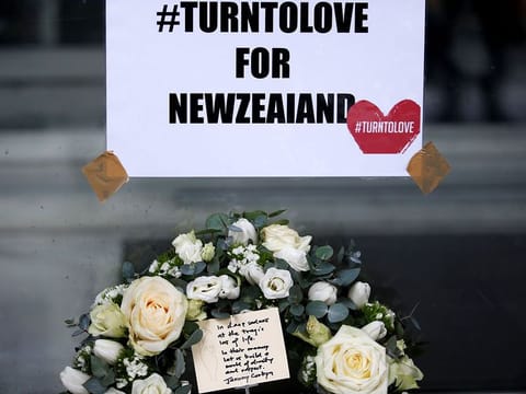A floral tribute with a card, placed by Britain's opposition Labour Party leader Jeremy Corbyn, is seen outside New Zealand House in London, Britain March 15, 2019.