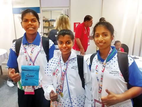 Indian athletes Jyothi A (left), Shruti M.S. (centre) and Rinci Biju after receiving their hearing aids.