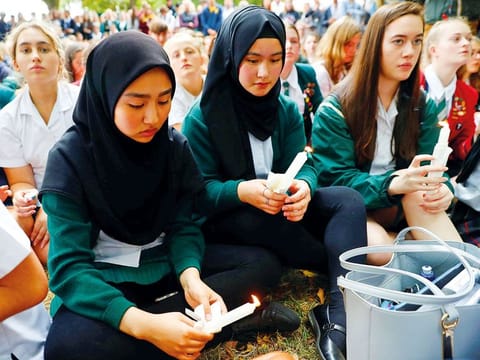 Students gather in a vigil to commemorate victims of Friday's shooting, outside Masjid Al Noor mosque in Christchurch, New Zealand March 18, 2019.