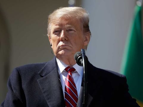 President Donald Trump listens during a news conference with Brazilian President Jair Bolsonaro in the Rose Garden of the White House.