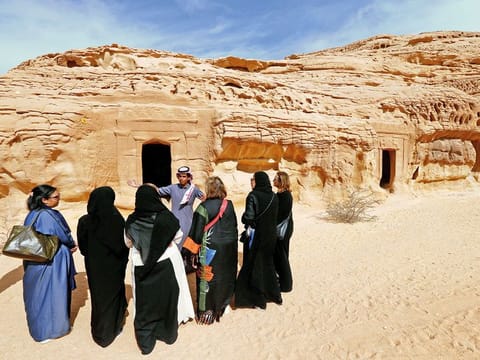 Tourists tour the rock-hewn tombs of Madain Saleh near the city of AlUla.  