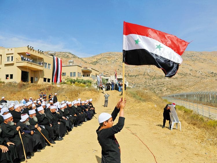 Druze people take part in a rally in Majdal Shams