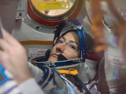 A photo provided by NASA of Christina Koch working inside the Soyuz MS-12 spacecraft at the Baikonur Cosmodrome in Kazakhstan.