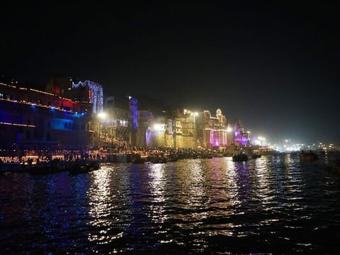 Devotees attend the Ganga Aarti at the Ganga Ghat, Varanasi. 