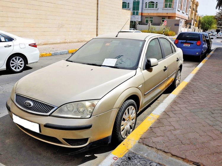 A dusty vehicle on an Abu Dhabi street