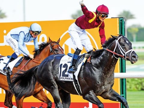 Jose Ortiz celebrates his victory aboard Coal Front in Group 2 Godolphin Mile at Meydan on Saturday.