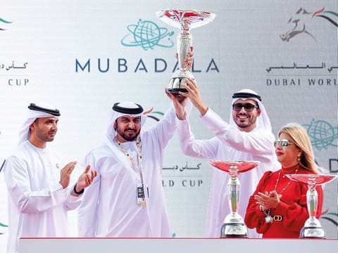 Khalid Khalifa Al Nabooda takes the trophy after AF Maher's win 