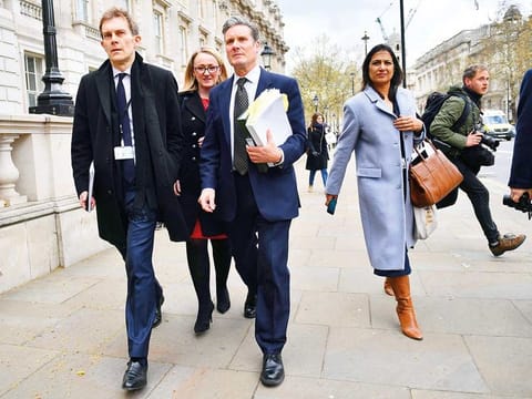 Labour’s new leader Keir Starmer (centre) leaves the Cabinet Office in London 